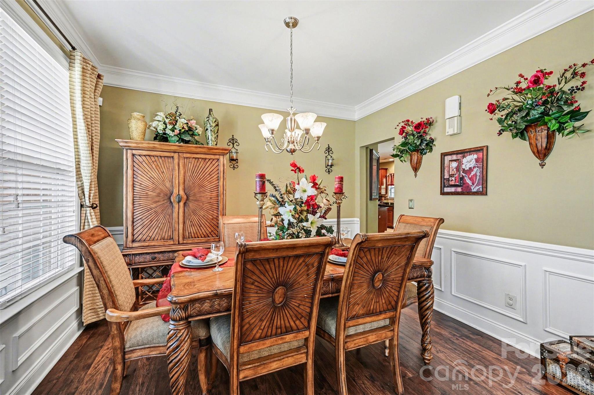 10812 Clark Street Davidson, NC 28036 - Photo 10 of 32 a view of a dining room with furniture and chandelier