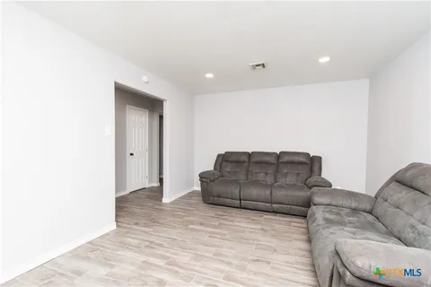 a living room with furniture and a couch