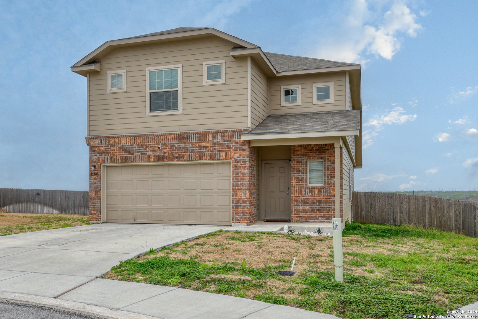 10546 Midsummer Meadow Converse, TX 78109 - Photo 1 of 18 a front view of a house with garden