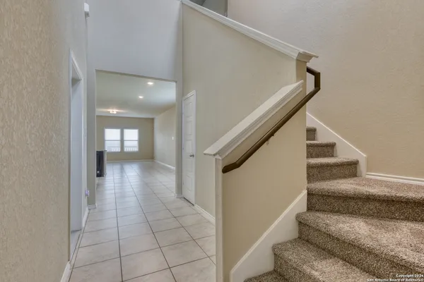 a view of entryway and hall with a rug