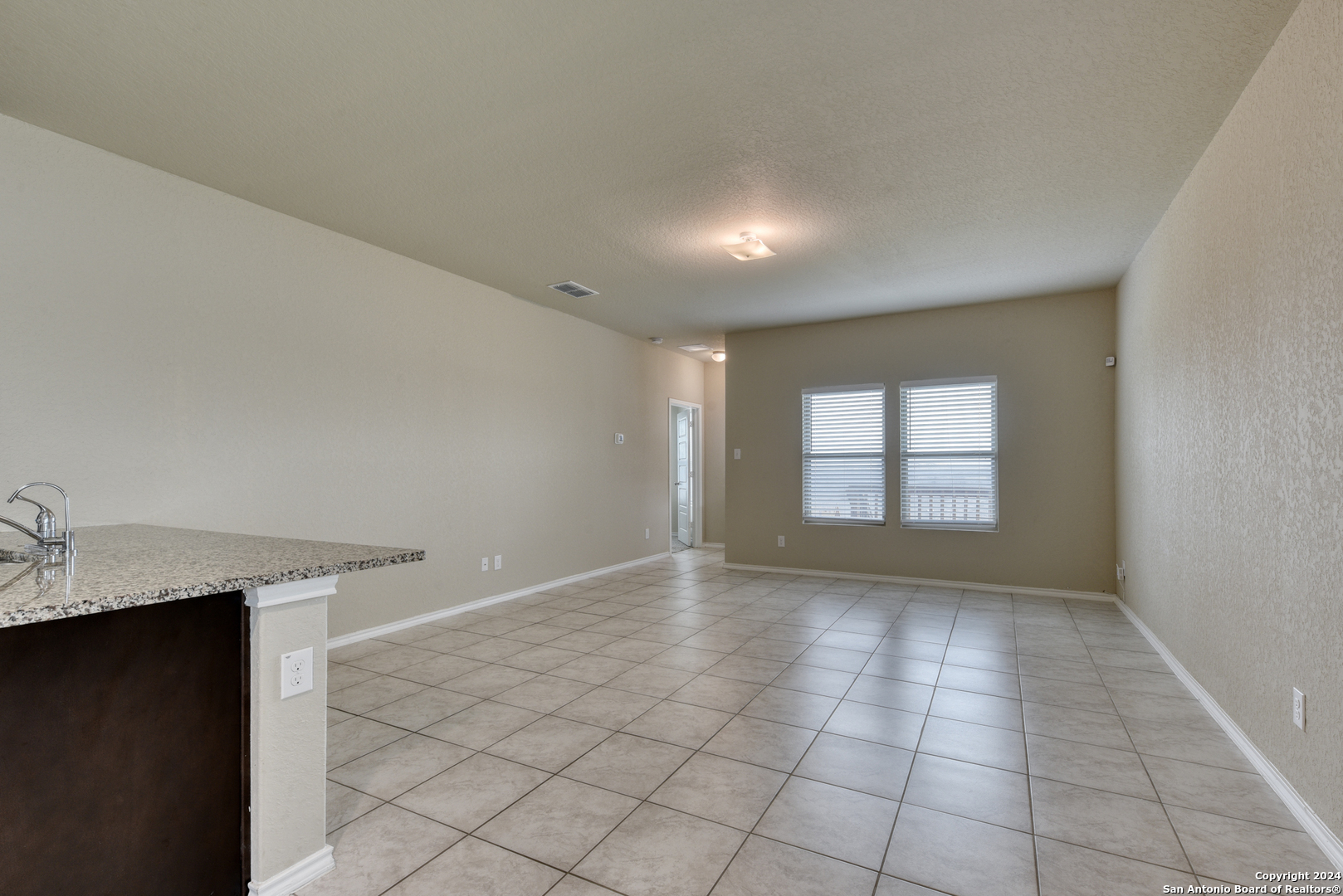10546 Midsummer Meadow Converse, TX 78109 - Photo 4 of 18 a view of an empty room with a window