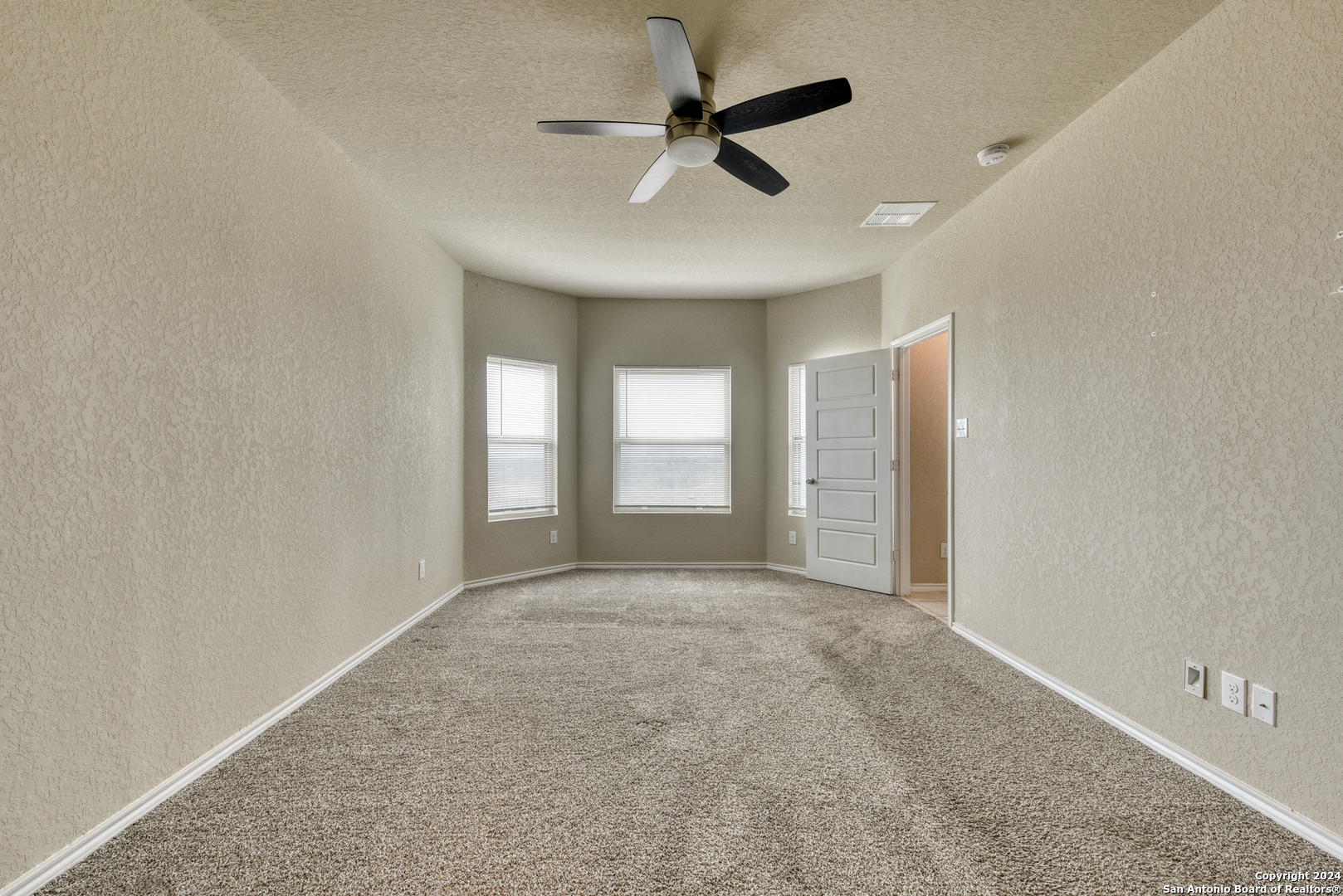 10546 Midsummer Meadow Converse, TX 78109 - Photo 7 of 18 a view of an empty room with a window