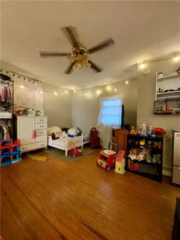 a view of a room with gym equipment and a large window