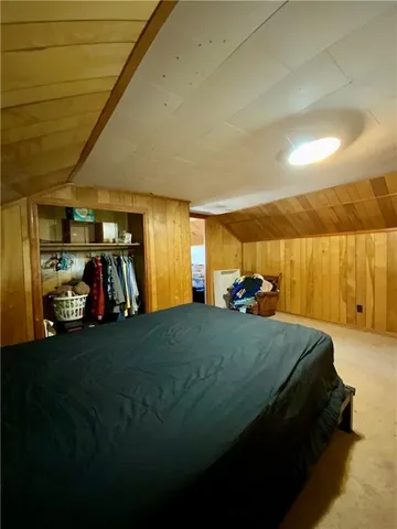 a bed room with a bed and a lamp