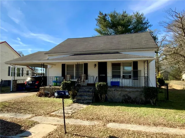 a front view of a house with a patio