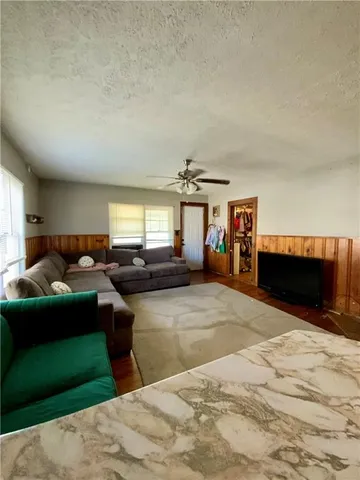 a bedroom with a bed and a mirror