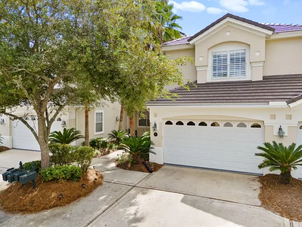 a front view of a house with a garage