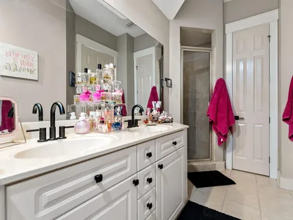 a bathroom with a sink a vanity and a mirror