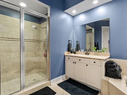 a bathroom with a toilet a sink and shower