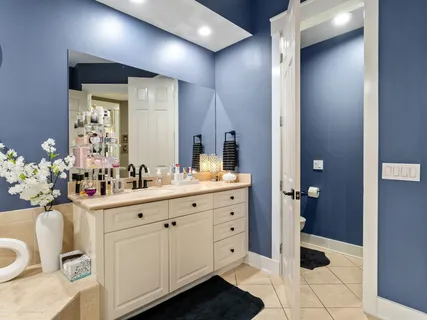 a bedroom with a bed and cabinets