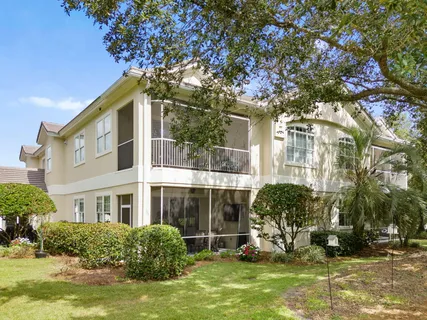 an aerial view of a houses with a lake view and mountain view