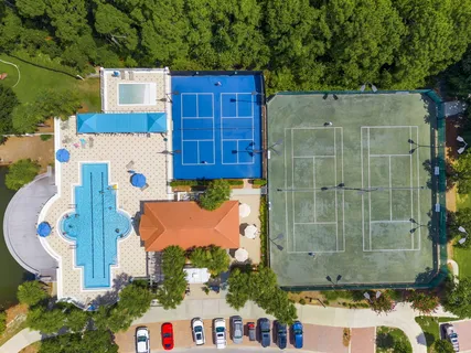 a view of a swimming pool with a lounge chairs