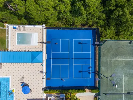 an aerial view of a house with yard swimming pool and outdoor seating