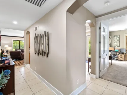 a kitchen with stainless steel appliances granite countertop a sink a stove top oven a counter space and cabinets