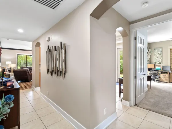 a kitchen with stainless steel appliances granite countertop a sink a stove top oven a counter space and cabinets