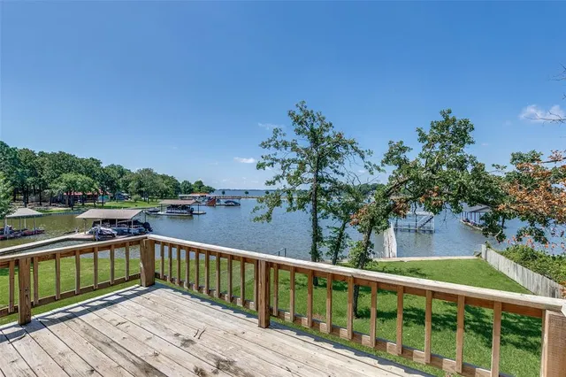 a view of a balcony with wooden floor