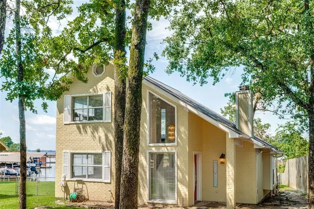 front view of a house with a tree