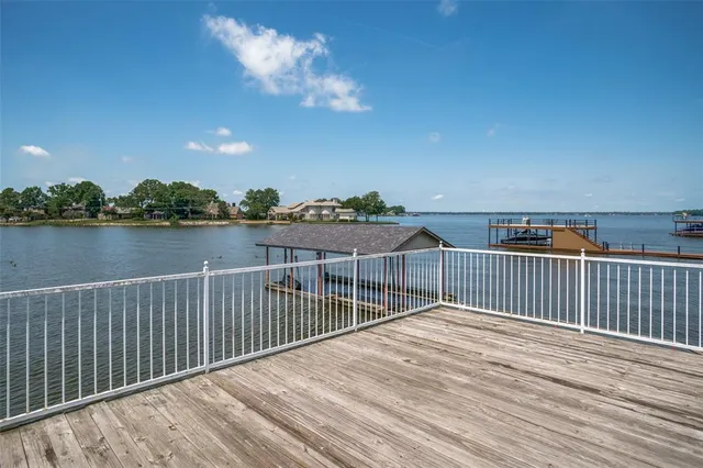 a view of a balcony with wooden floor