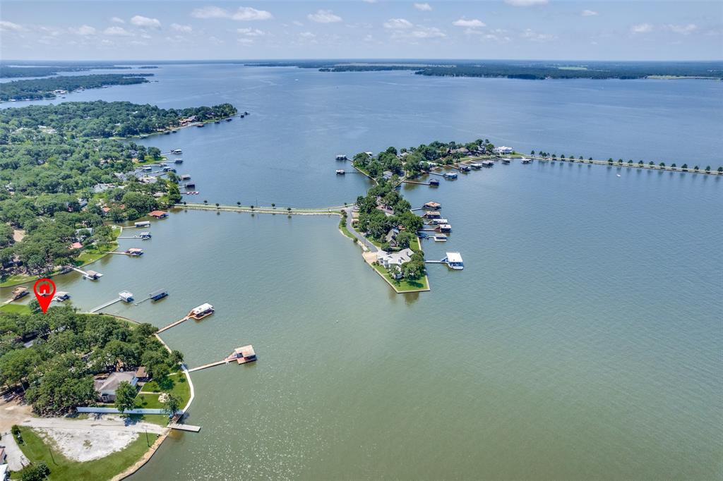 162 Aztec Drive Mabank, TX 75156 - Photo 30 of 30 an aerial view of a house with a yard and lake view