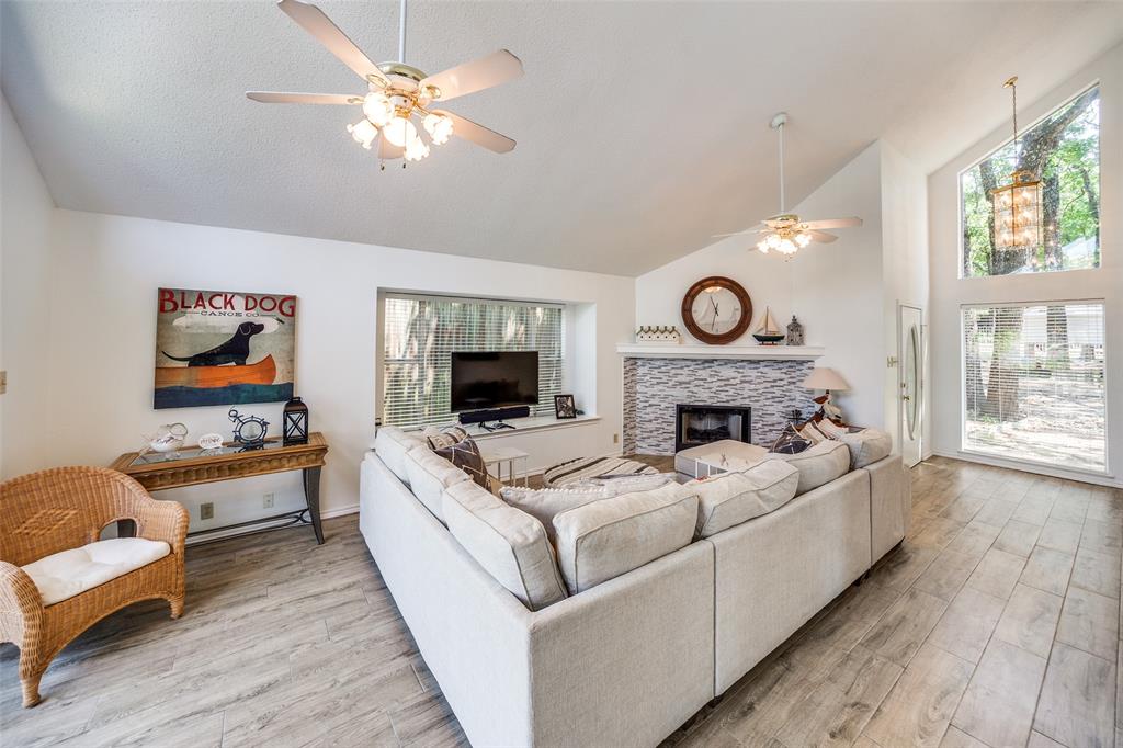 162 Aztec Drive Mabank, TX 75156 - Photo 3 of 30 a living room with furniture and a fireplace