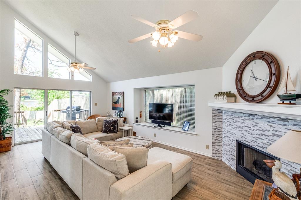 162 Aztec Drive Mabank, TX 75156 - Photo 4 of 30 a living room with furniture a fireplace and a flat screen tv