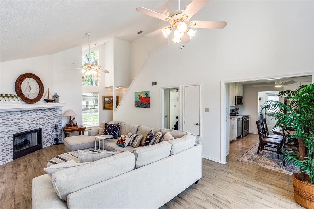 162 Aztec Drive Mabank, TX 75156 - Photo 6 of 30 a living room with furniture a fireplace and a potted plant