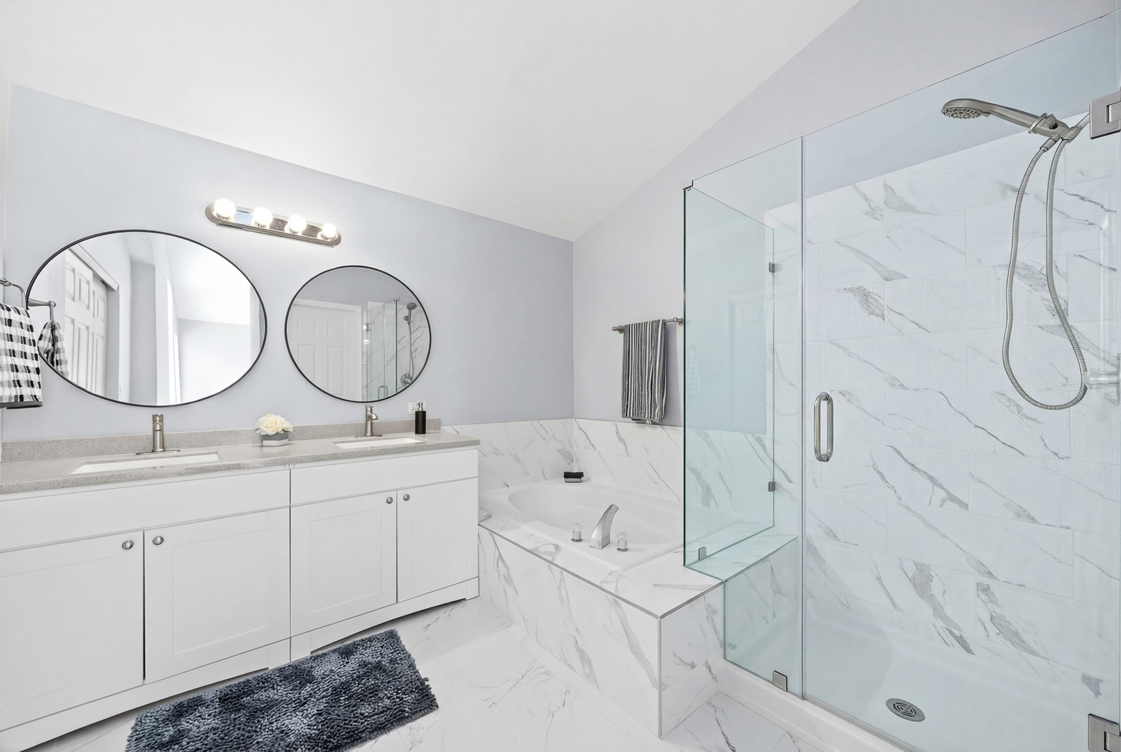 631 Kingsbrooke Crossing Bolingbrook, IL 60440 - Photo 22 of 40 a bathroom with a double vanity sink mirror and a shower
