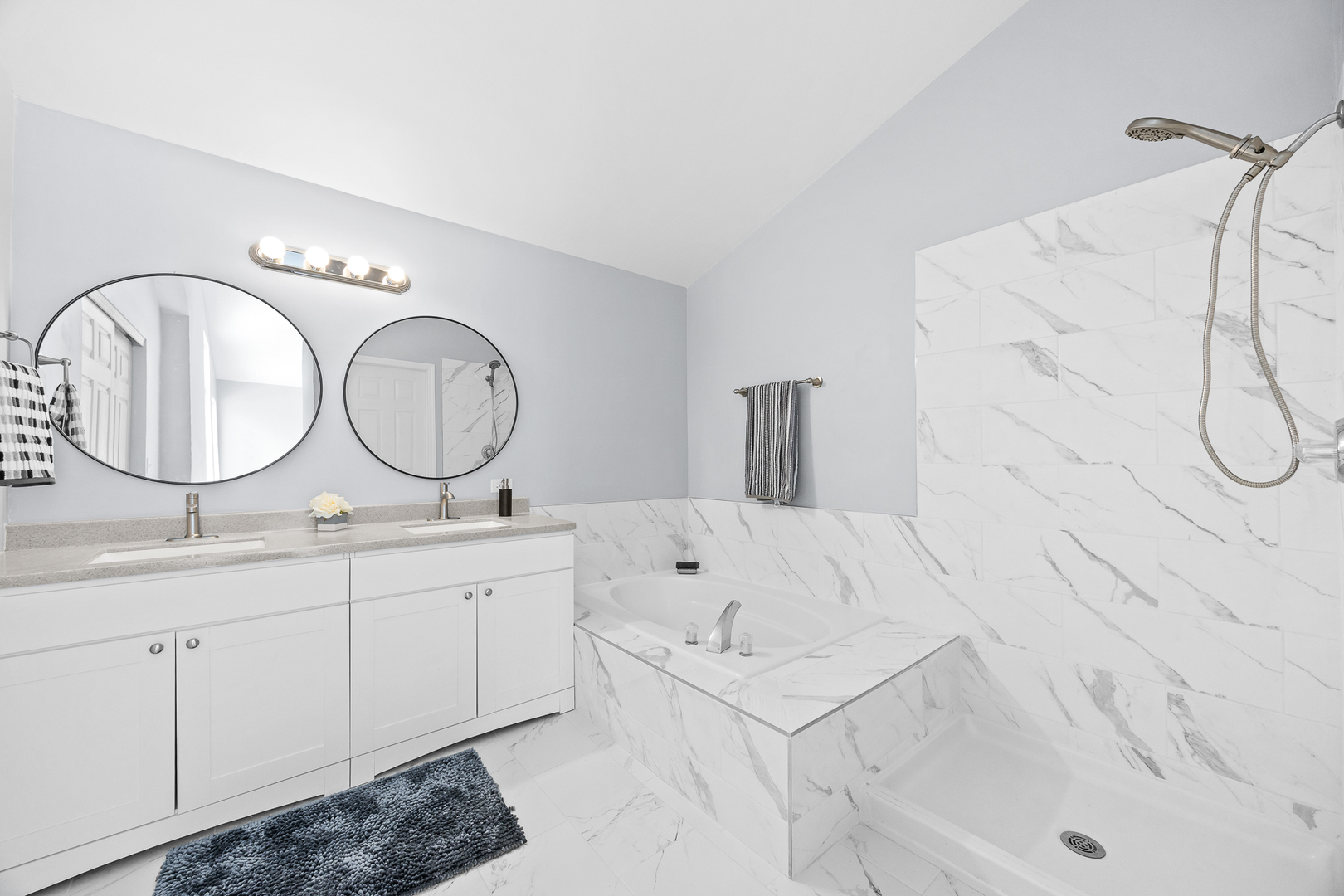 631 Kingsbrooke Crossing Bolingbrook, IL 60440 - Photo 23 of 40 a bathroom with a sink and a mirror