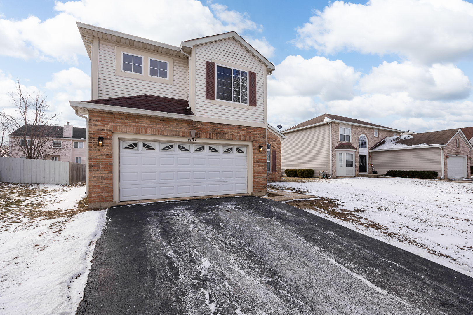 631 Kingsbrooke Crossing Bolingbrook, IL 60440 - Photo 34 of 40 a view of a house with a snow in the background