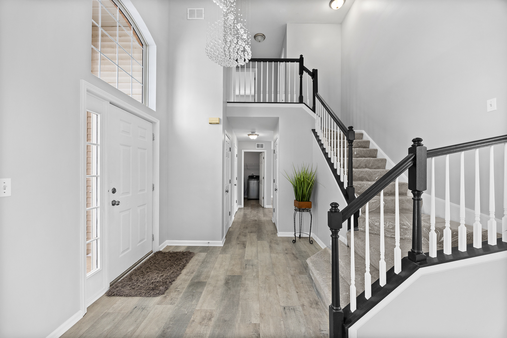 631 Kingsbrooke Crossing Bolingbrook, IL 60440 - Photo 4 of 40 a view of staircase with wooden floor and stairs