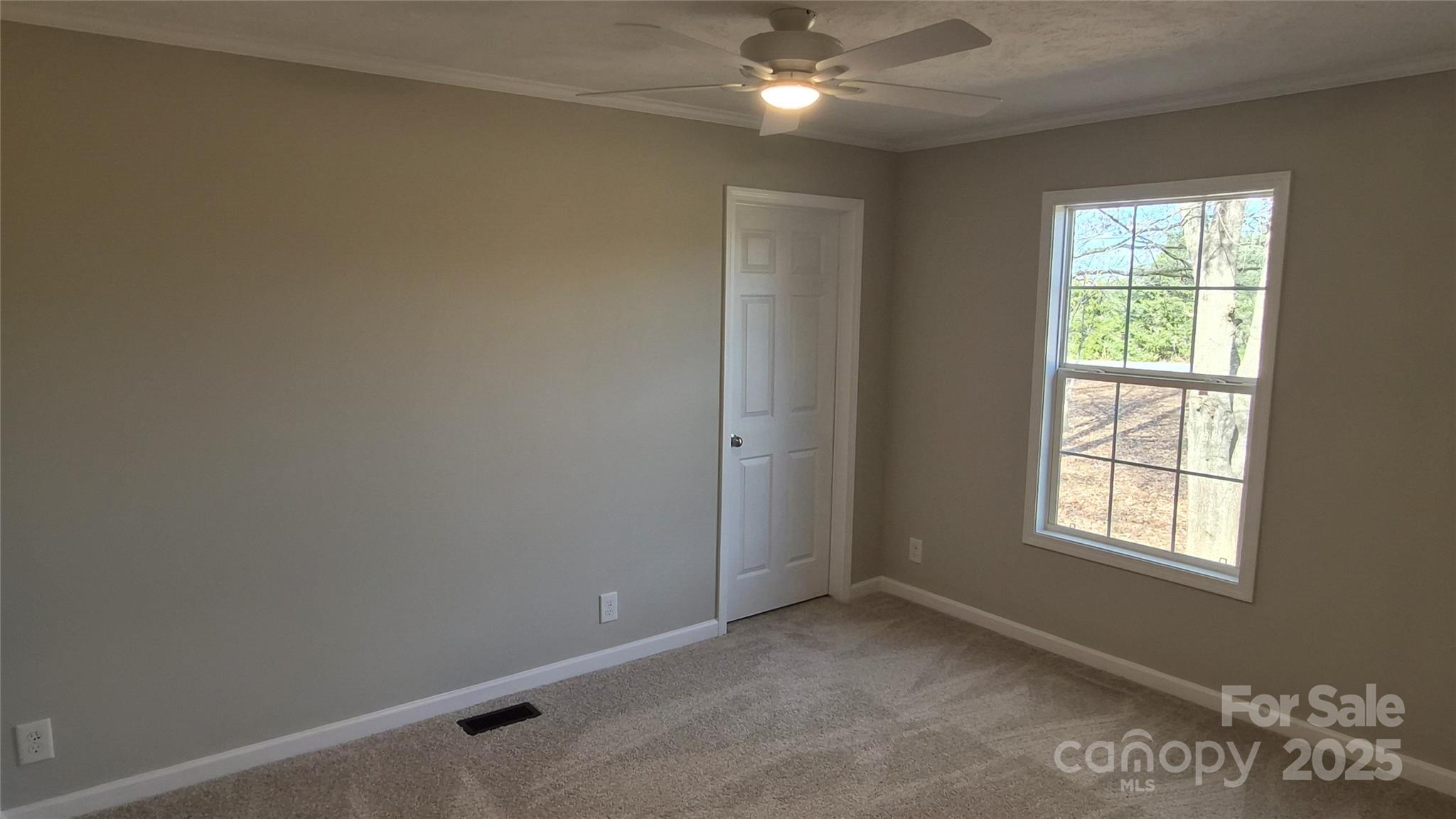 680 Tirzah Church Road Lancaster, SC 29720 - Photo 13 of 25 an empty room with windows and fan