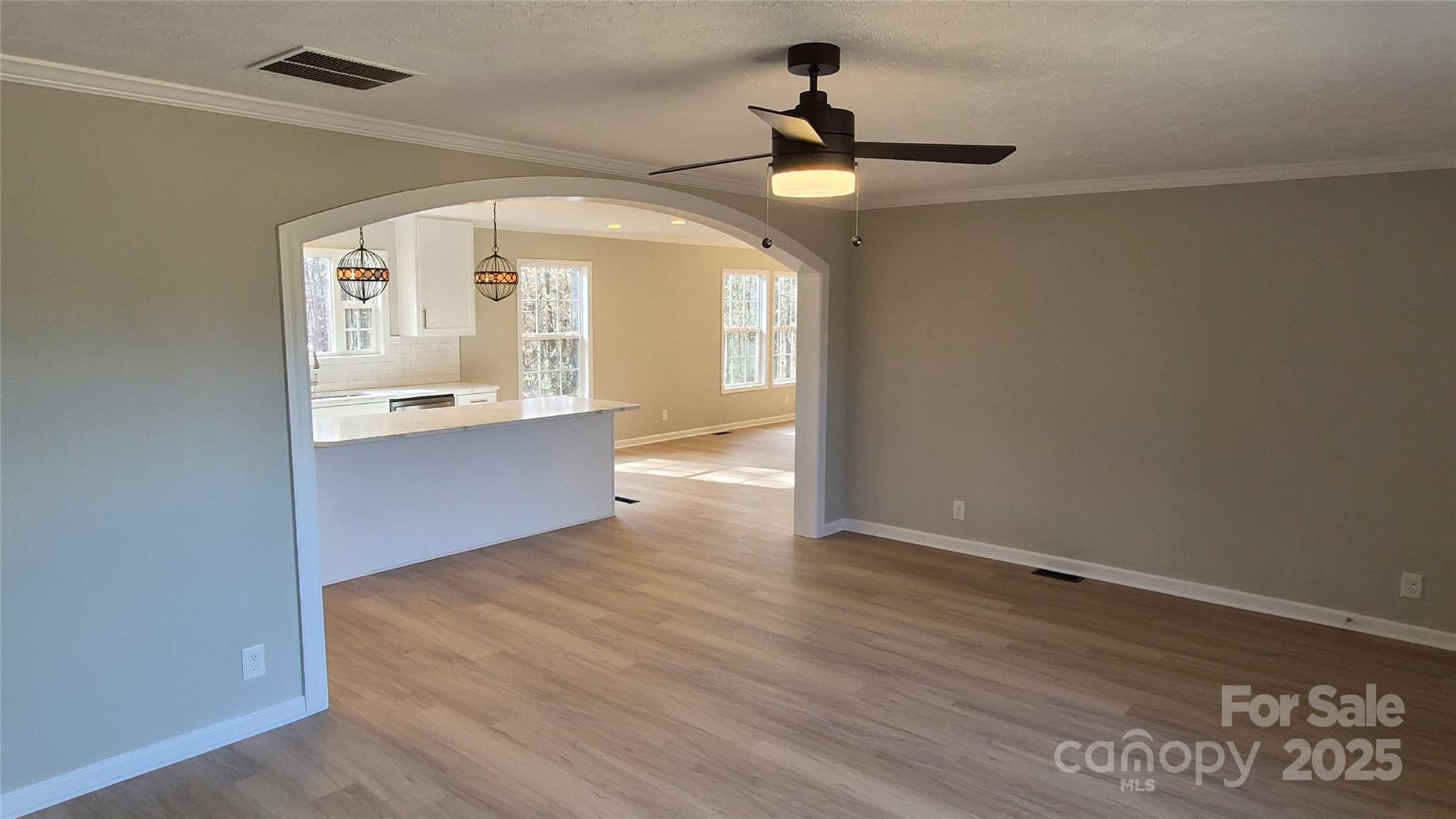 680 Tirzah Church Road Lancaster, SC 29720 - Photo 4 of 25 wooden floor in an empty room with a window