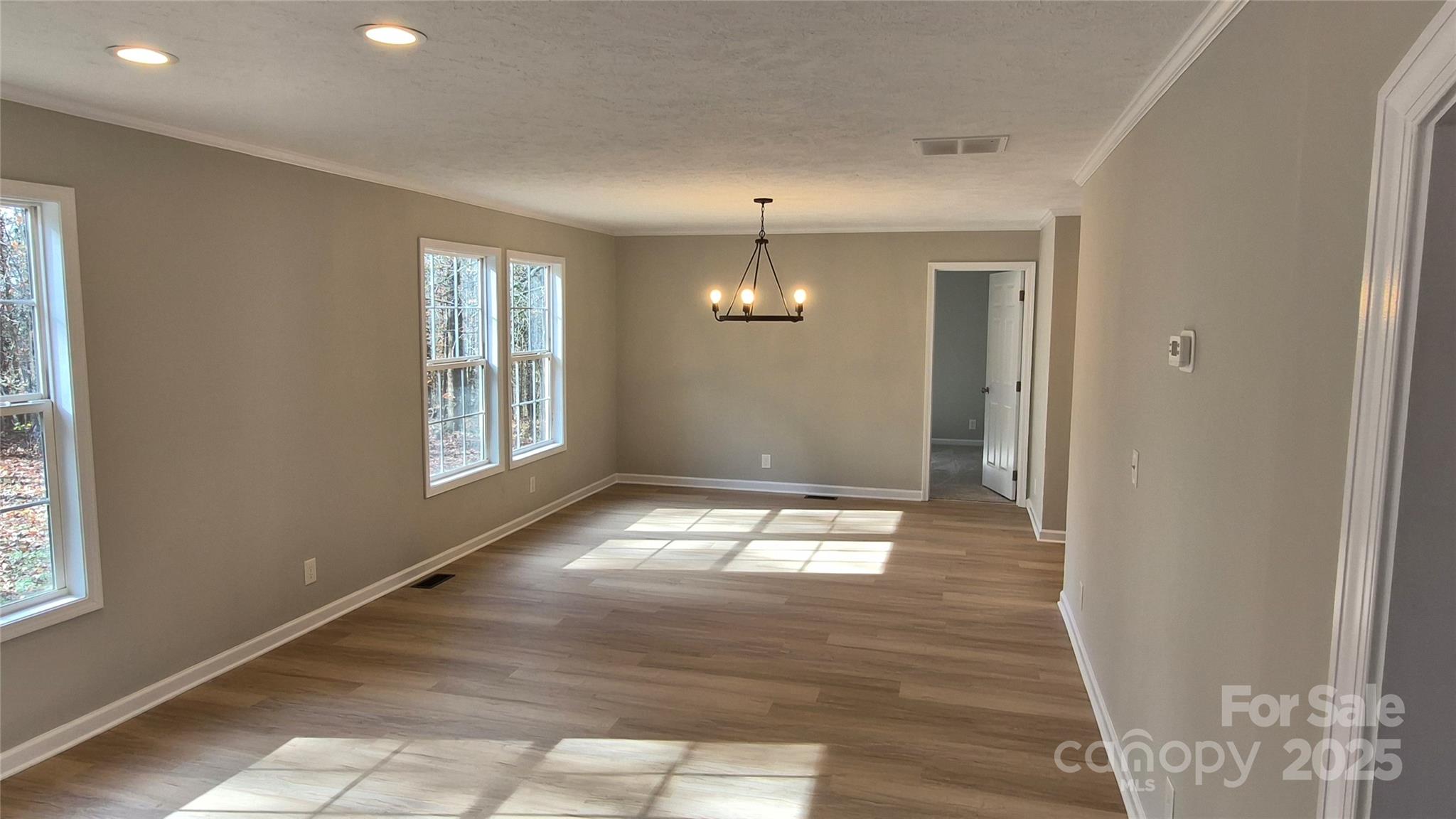 680 Tirzah Church Road Lancaster, SC 29720 - Photo 6 of 25 a view of empty room with wooden floor and fan