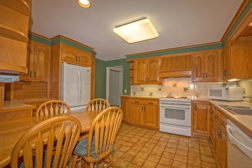 477 Wolf Swamp Road Longmeadow, MA 01106 - Photo 17 of 35 a kitchen with a sink appliances and cabinets