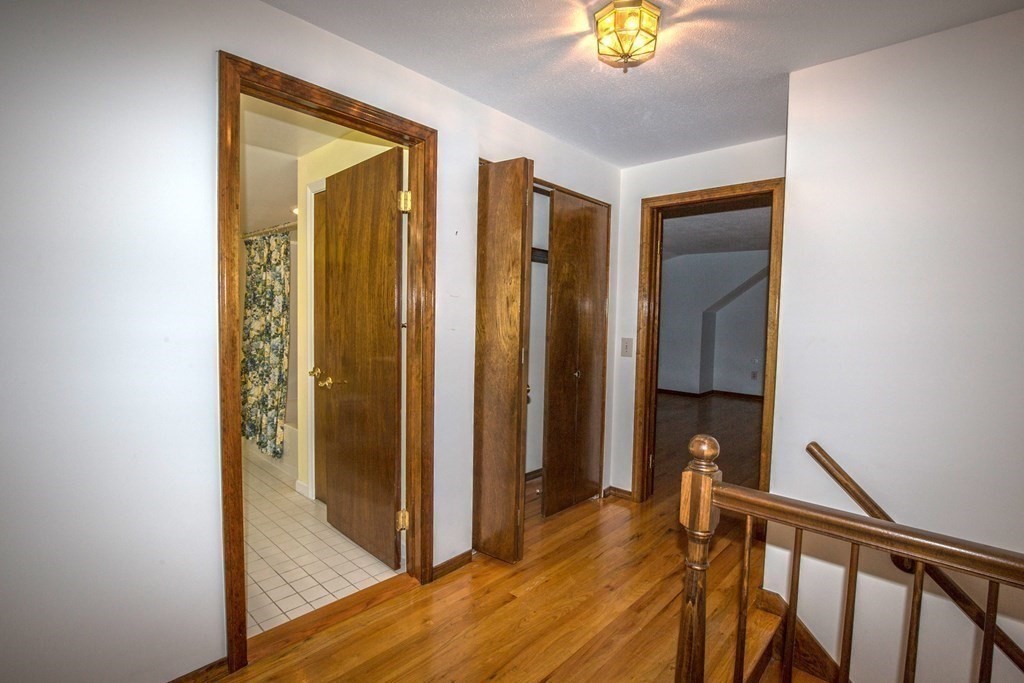 477 Wolf Swamp Road Longmeadow, MA 01106 - Photo 27 of 35 a view of hallway with livingroom and wooden floor