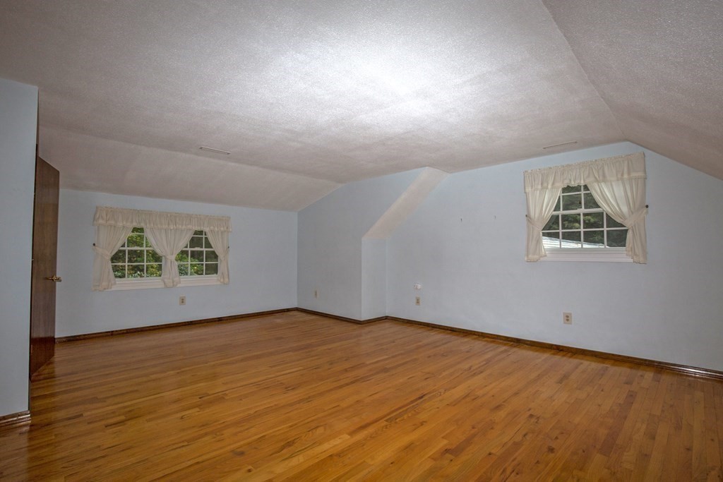477 Wolf Swamp Road Longmeadow, MA 01106 - Photo 30 of 35 a view of an empty room with wooden floor and a window