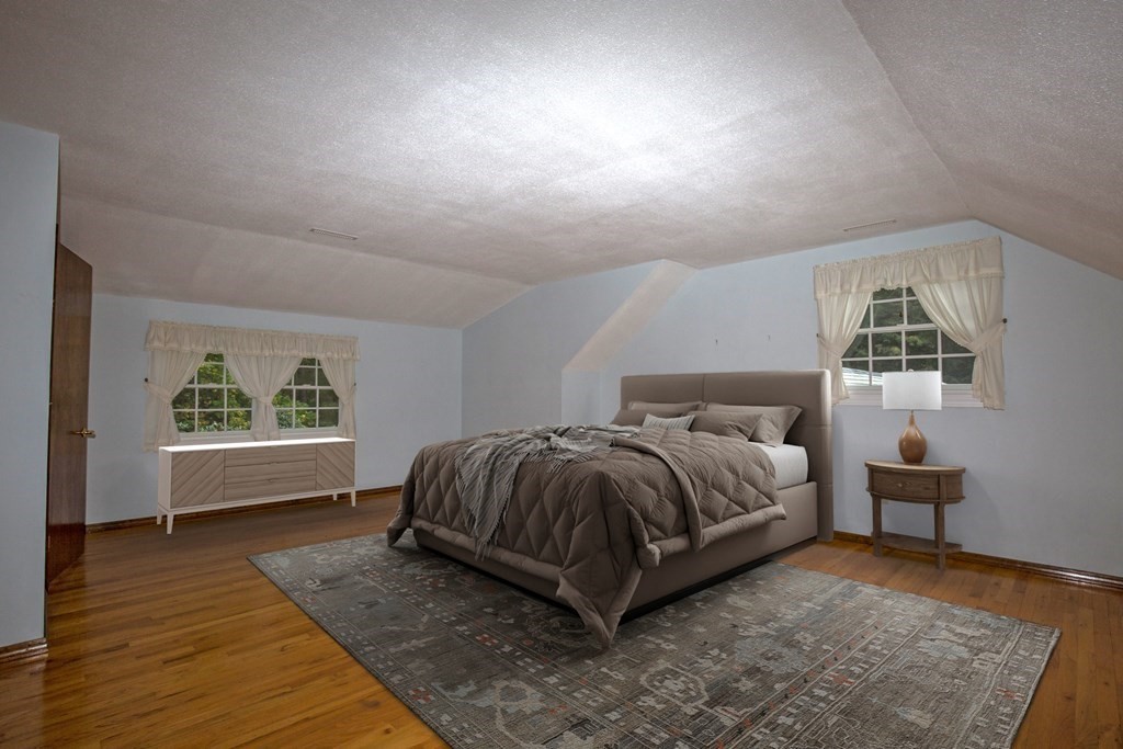 477 Wolf Swamp Road Longmeadow, MA 01106 - Photo 31 of 35 a spacious bedroom with a bed and window