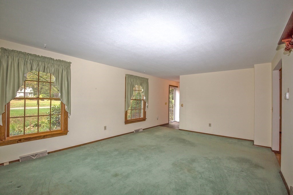 477 Wolf Swamp Road Longmeadow, MA 01106 - Photo 9 of 35 an empty room with windows