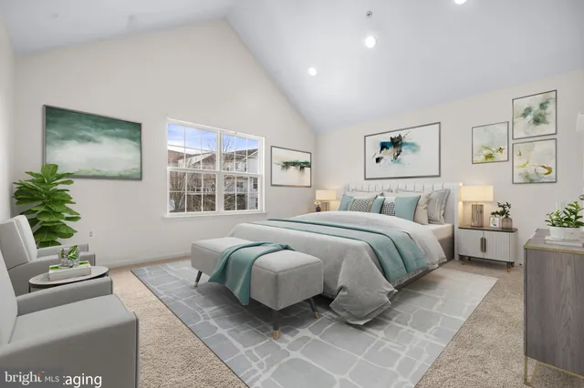 a bedroom with a large bed and a couch