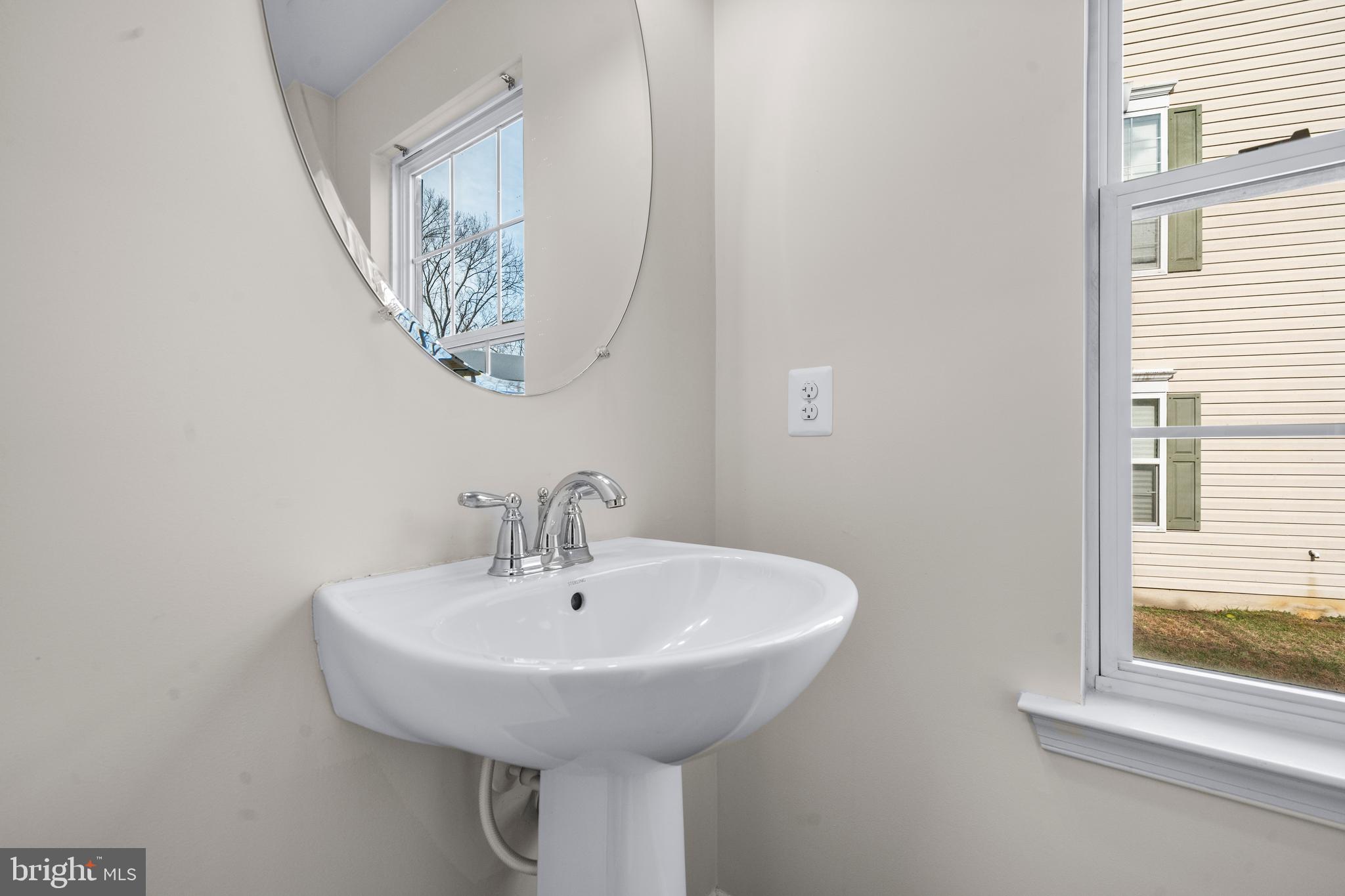 109 Gray Street Capitol Heights, MD 20743 - Photo 28 of 35 a bathroom with a sink and a mirror