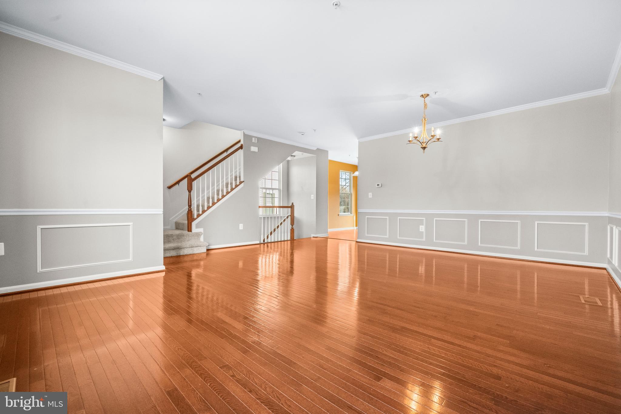 109 Gray Street Capitol Heights, MD 20743 - Photo 3 of 35 a view of an empty room with wooden floor and a window
