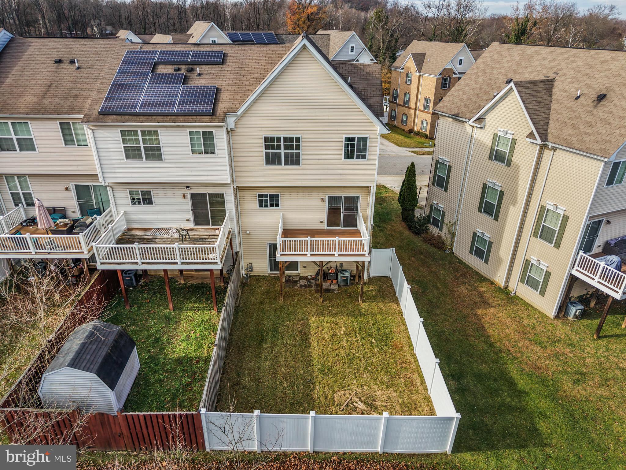 109 Gray Street Capitol Heights, MD 20743 - Photo 32 of 35 an aerial view of a house with swimming pool lawn chairs and a yard