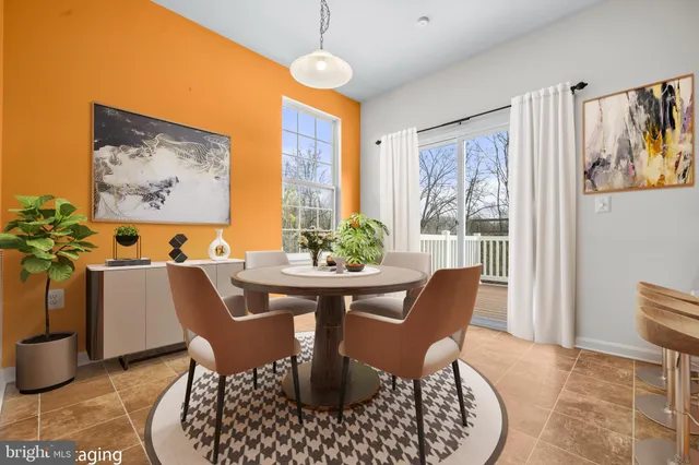 a view of a dining room with furniture window and outside view