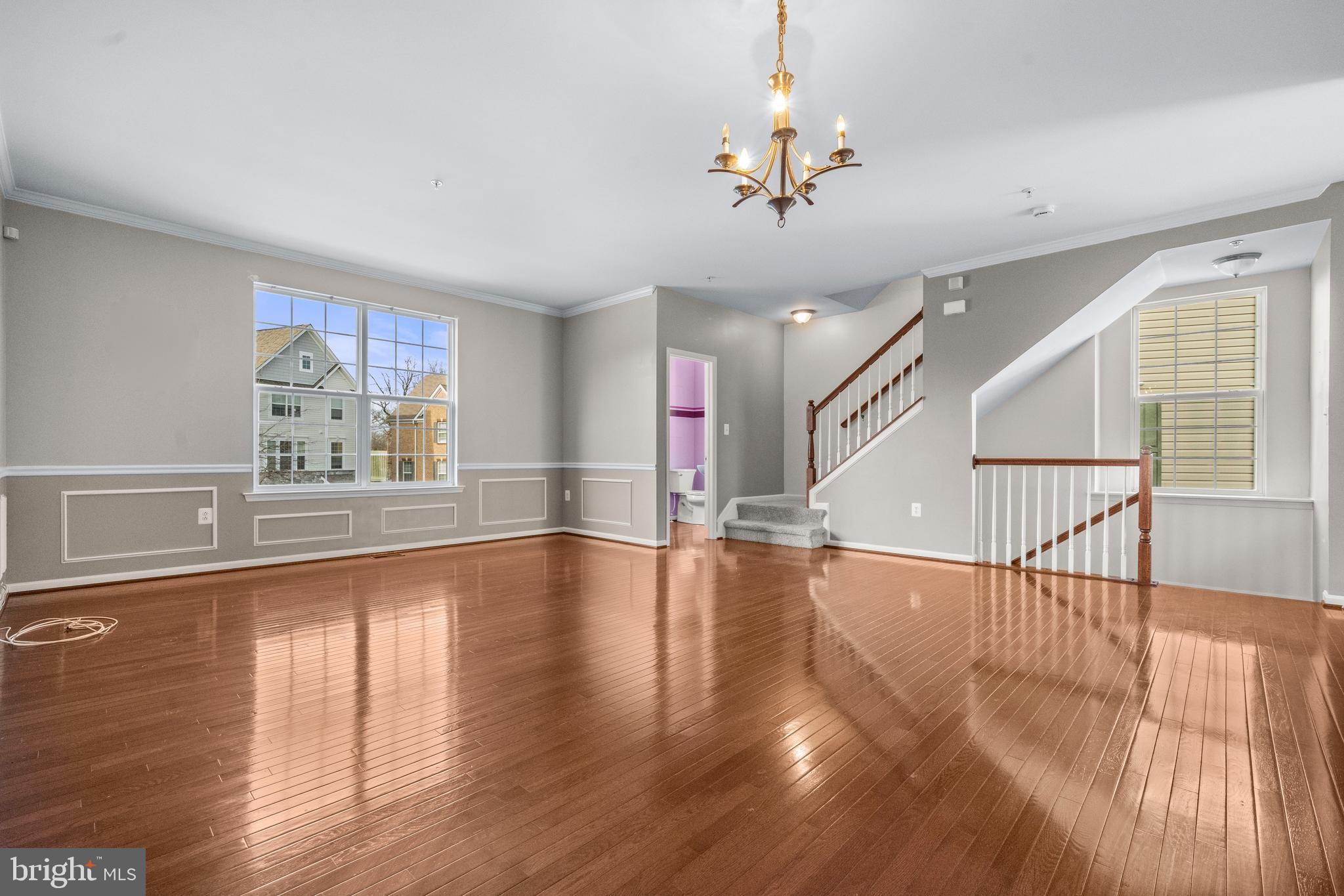 109 Gray Street Capitol Heights, MD 20743 - Photo 8 of 35 a view of empty room with wooden floor and fan