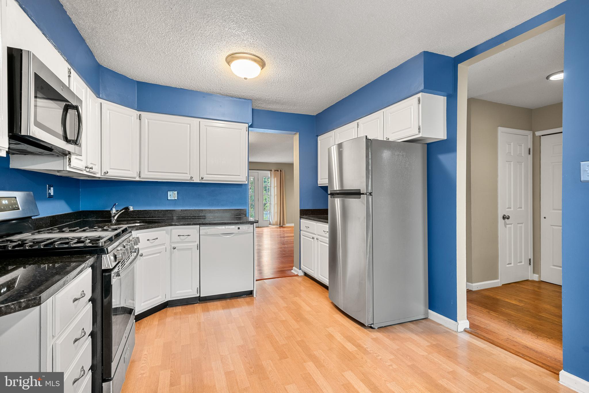5 Lantern Lane Chesterbrook, PA 19087 - Photo 14 of 30 a kitchen with a refrigerator stove and wooden cabinets