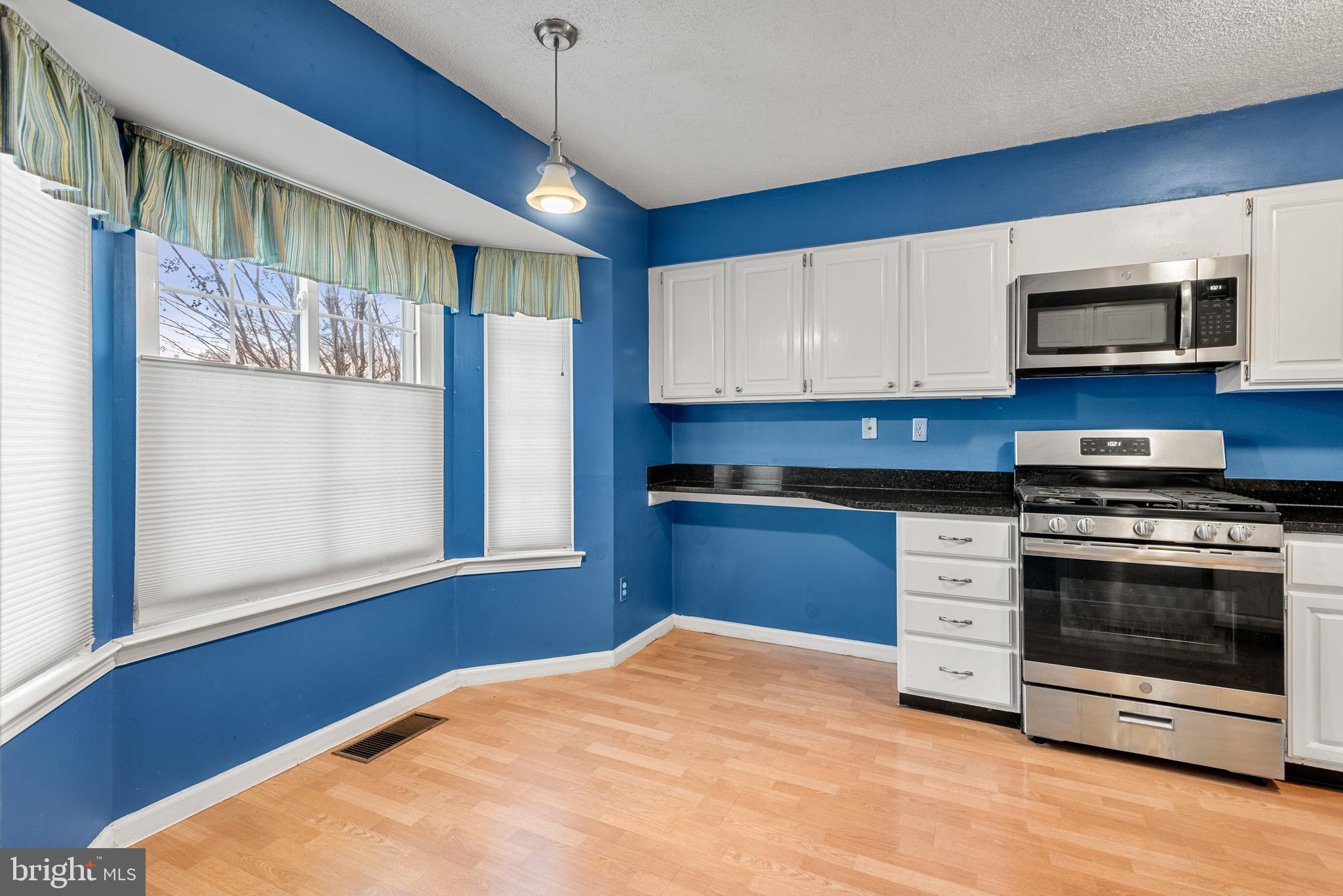 5 Lantern Lane Chesterbrook, PA 19087 - Photo 15 of 30 a kitchen with stainless steel appliances granite countertop a stove a sink and a microwave