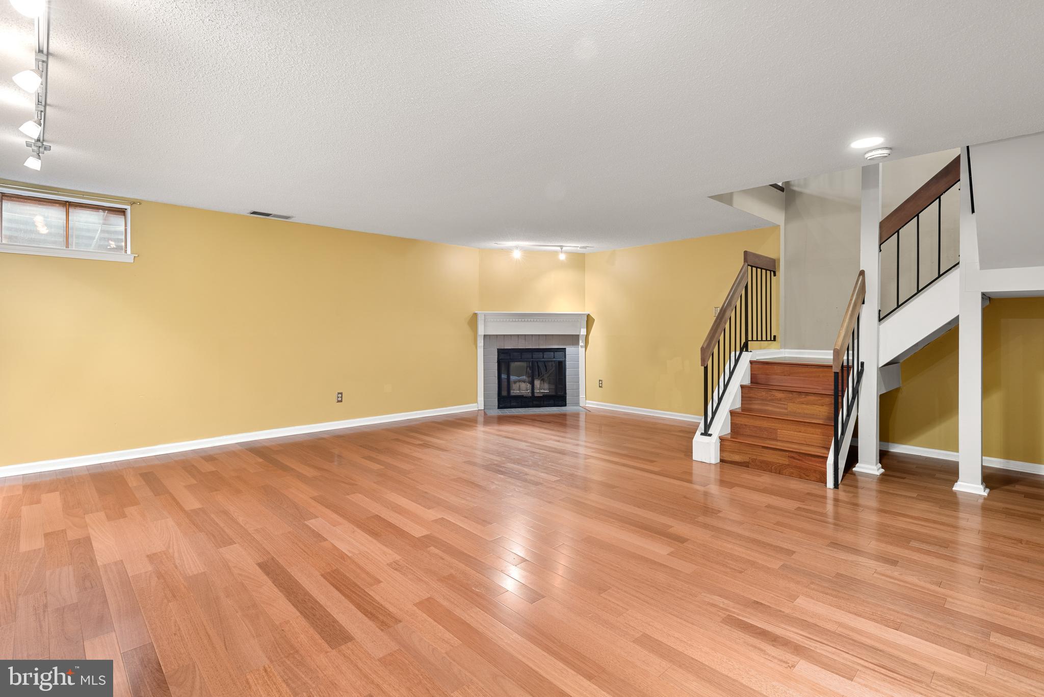 5 Lantern Lane Chesterbrook, PA 19087 - Photo 16 of 30 a view of empty room with wooden floor and fireplace