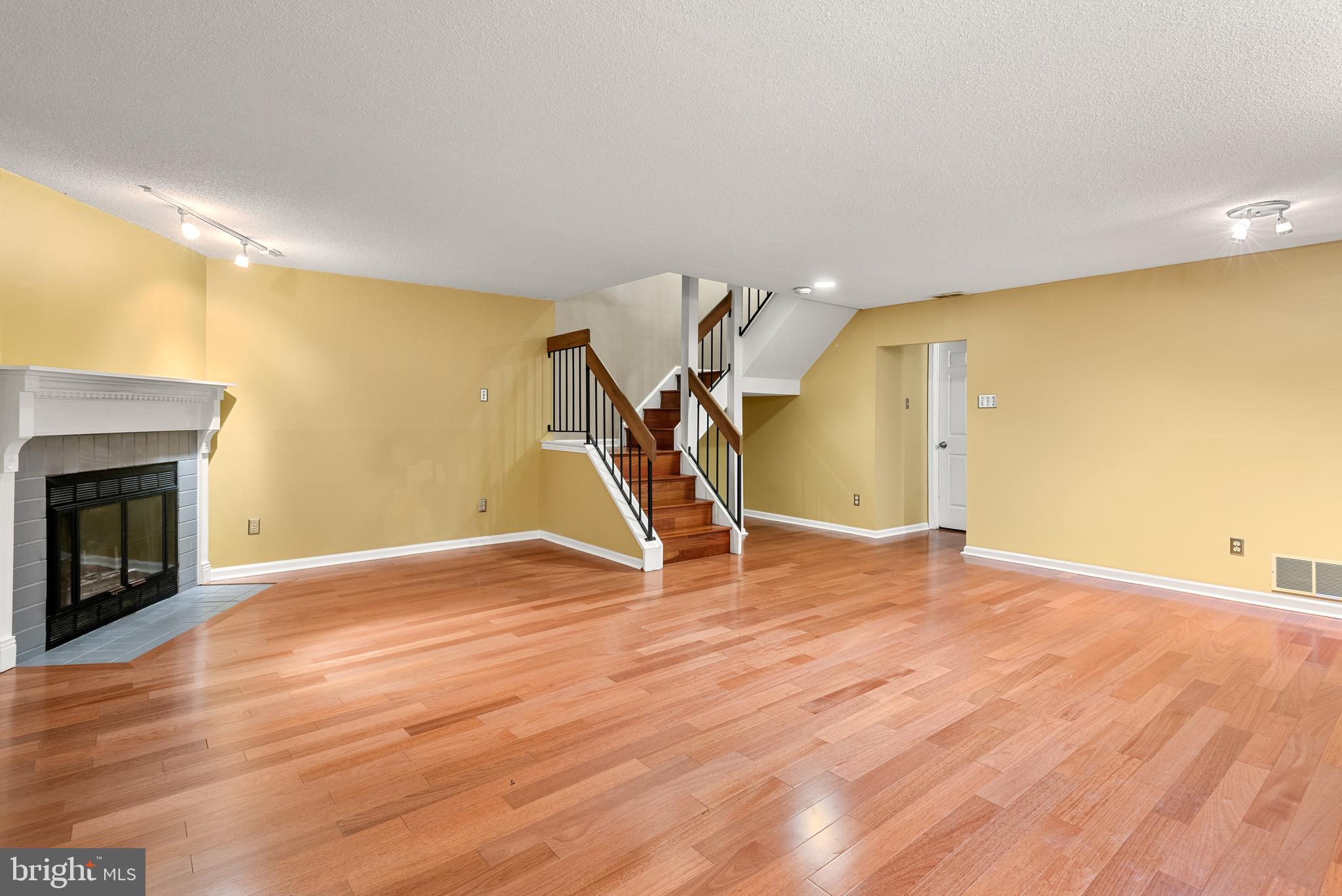 5 Lantern Lane Chesterbrook, PA 19087 - Photo 17 of 30 a view of empty room with wooden floor and fireplace
