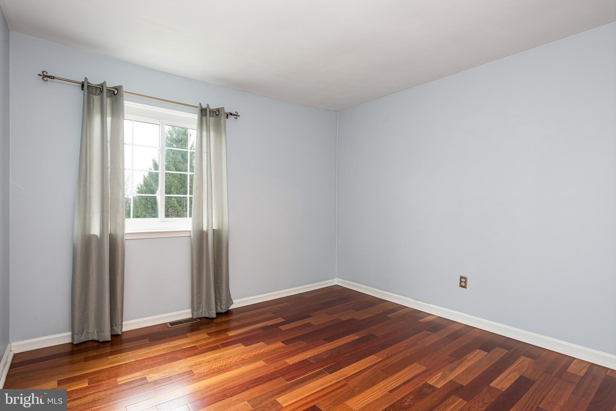 5 Lantern Lane Chesterbrook, PA 19087 - Photo 20 of 30 a view of a room with wooden floor and windows