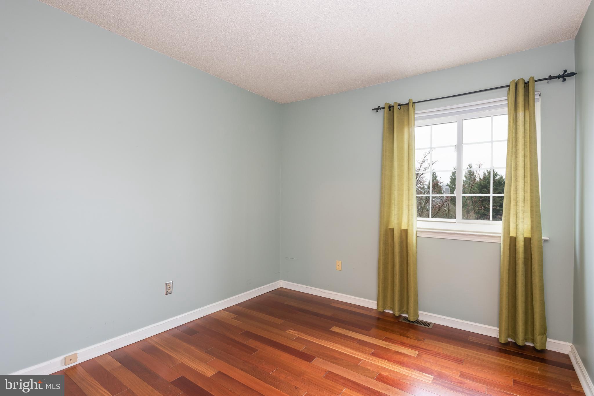 5 Lantern Lane Chesterbrook, PA 19087 - Photo 21 of 30 a view of empty room with wooden floor and fan